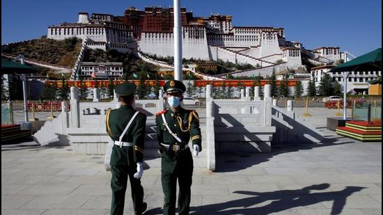 Paramilitary police officers swap positions during a change of guard in front of Potala Palace in Lhasa. (REUTERS/FILE) Paramilitary police officers swap positions during a change of guard in front of Potala Palace in Lhasa. (REUTERS/FILE)