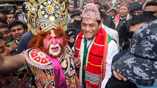 Assam Chief Minister Sarbananda Sonowal with BJP supporters as he arrives to file his nomination for the upcoming state assembly polls, in Majuli on Tuesday, March 9, 2021. (PTI Photo)