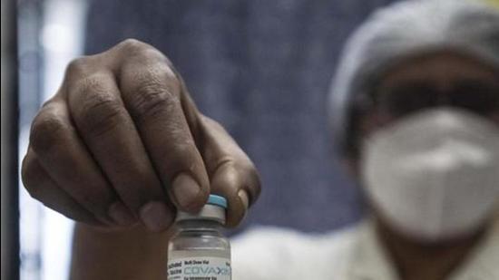 A health worker shows Bharat Biotech’s Covaxin ahead of the nationwide Covid-19 vaccine roll out, in Pune on January 15. (HT file) A health worker shows Bharat Biotech’s Covaxin ahead of the nationwide Covid-19 vaccine roll out, in Pune on January 15. (HT file)