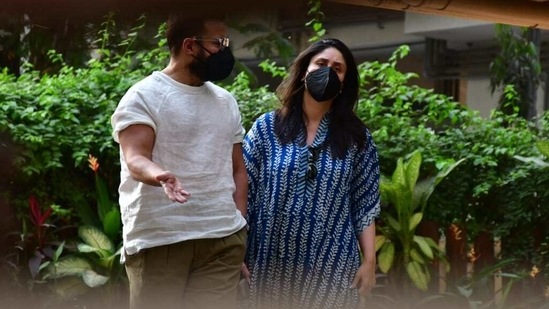 While Saif wore a white T-shirt with olive green cargo pants, Kareena kept it casual in a blue kaftan.(Varinder Chawla)