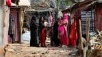 Rohingya refugees stand outside their makeshift camp on the outskirts of Jammu,(AP Photo) Rohingya refugees stand outside their makeshift camp on the outskirts of Jammu,(AP Photo)