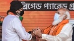 Prime Minister Narendra Modi with Bollywood actor Mithun Chakraborty after he joined BJP during a public meeting ahead of West Bengal Assembly Polls. (PTI Photo) Prime Minister Narendra Modi with Bollywood actor Mithun Chakraborty after he joined BJP during a public meeting ahead of West Bengal Assembly Polls. (PTI Photo)