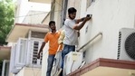 Workers install CCTV cameras at government flats, at Pandara Road, in New Delhi.(Arvind Yadav / Hindustan Times) Workers install CCTV cameras at government flats, at Pandara Road, in New Delhi.(Arvind Yadav / Hindustan Times)