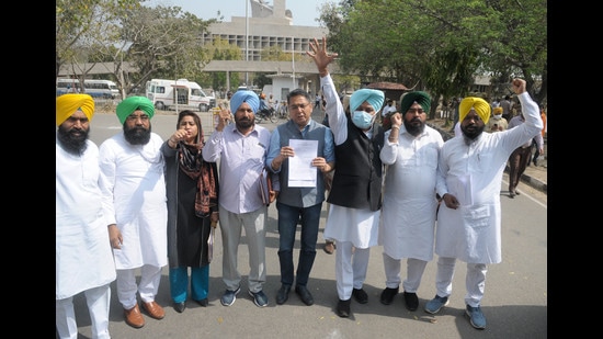 Aam Aadmi Party MLAs protesting against the imposition of new tax outside the Punjab Vidhan Sabha in Chandigarh on Wednesday. (Ravi Kumar/ HT)