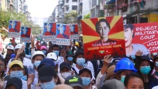 Anti-coup protesters hold up images of deposed leader Aung San Suu Kyi as they gather in Yangon, Myanmar (AP) Anti-coup protesters hold up images of deposed leader Aung San Suu Kyi as they gather in Yangon, Myanmar (AP)