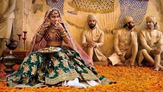In one shot Masaba Gupta can be seen dolled up as a Sabyasachi bride as she enjoys a quick bite.(Instagram )