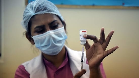 A medical worker fills the syringe with the Covid-19 vaccine to inoculate it to elderly people during the second phase of the Covid-19 vaccination at a hospital in New Delhi on Friday.(ANI Photo)