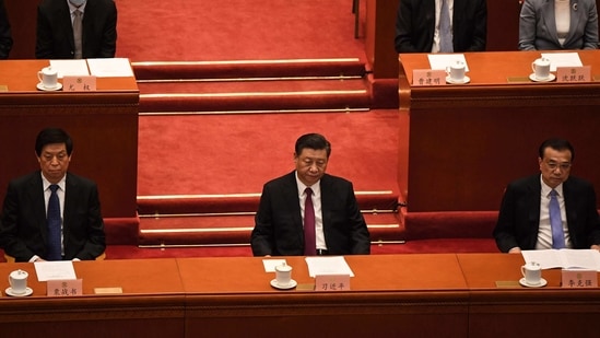 China's President Xi Jinping (C), Premier Li Keqiang (R) and National People's Congress Chairman Li Zhanshu (L) attend the closing session of the Chinese People's Political Consultative Conference (CPPCC) at the Great Hall of the People in Beijing on March 10, 2021. (Photo by Noel CELIS / AFP)(AFP)
