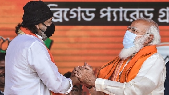 Prime Minister Narendra Modi with Bollywood actor Mithun Chakraborty after he joined BJP during a public meeting ahead of West Bengal Assembly Polls. (PTI Photo) Prime Minister Narendra Modi with Bollywood actor Mithun Chakraborty after he joined BJP during a public meeting ahead of West Bengal Assembly Polls. (PTI Photo)