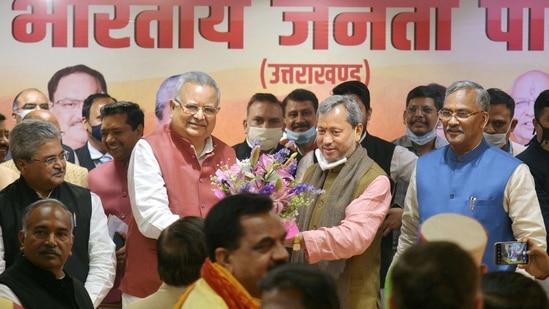 Dehradun: BJP central observer Raman Singh greets Tirath Singh Rawat after being elected as the new Chief Minister of Uttarakhand, in Dehradun, (PTI) Dehradun: BJP central observer Raman Singh greets Tirath Singh Rawat after being elected as the new Chief Minister of Uttarakhand, in Dehradun, (PTI)