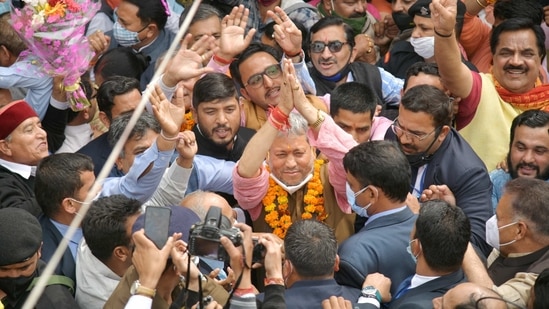 BJP leader Tirath Singh Rawat greets his supporters after he was elected as new Chief Minister of Uttarakhand, in Dehradun, Wednesday, March 10, 2021. (PTI Photo)