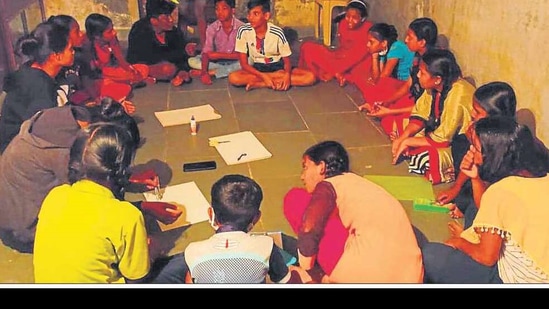 The students gather at a study circle at the Sanjay Nagar slums. HT PHOTO