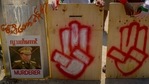 Anti-coup protesters stand behind a line of makeshift shields marked with a three-fingered salute and defaced image of Commander in chief, Senior Gen. Min Aung Hlaing as they gather to protest in Yangon, Myanmar(AP) Anti-coup protesters stand behind a line of makeshift shields marked with a three-fingered salute and defaced image of Commander in chief, Senior Gen. Min Aung Hlaing as they gather to protest in Yangon, Myanmar(AP)