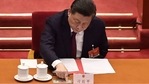 China's President Xi Jinping votes on changes to Hong Kong's election system during the closing session of the National People's Congress at the Great Hall of the People in Beijing on March 11, 2021.(NICOLAS ASFOURI / AFP) China's President Xi Jinping votes on changes to Hong Kong's election system during the closing session of the National People's Congress at the Great Hall of the People in Beijing on March 11, 2021.(NICOLAS ASFOURI / AFP)
