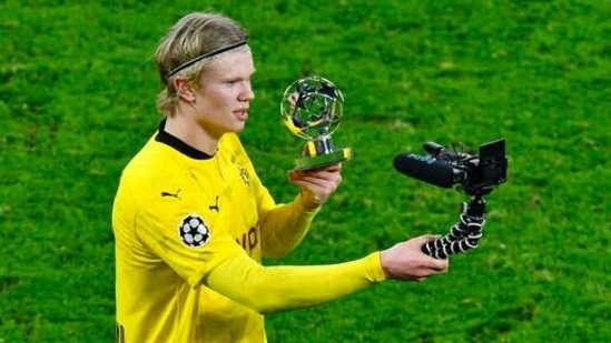 Dortmund's Erling Haaland films himself with a trophy for a man of the match after the Champions League, round of 16, second leg soccer match between Borussia Dortmund and Sevilla FC in Dortmund, Germany, Tuesday, March 9, 2021. (AP) Dortmund's Erling Haaland films himself with a trophy for a man of the match after the Champions League, round of 16, second leg soccer match between Borussia Dortmund and Sevilla FC in Dortmund, Germany, Tuesday, March 9, 2021. (AP)