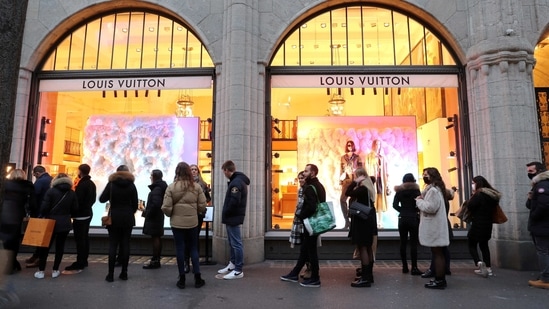 Customers queue to enter the Louis Vuitton luxury goods store on the  News Photo - Getty Images