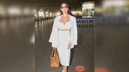 She added a pop of colour to the attire by carrying a tan Hermes Birkin bag. The actor was also seen wearing a brown-hued pair of sunnies and white heels. (Varinder Chawla) She added a pop of colour to the attire by carrying a tan Hermes Birkin bag. The actor was also seen wearing a brown-hued pair of sunnies and white heels. (Varinder Chawla)