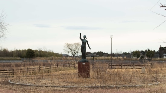 A statue stands surrounded by weeds at a park in the exclusion zone in Tomioka town, Fukushima prefecture, northeastern Japan, on February 26, 2021. The no-go zone sits on its northeastern corner within about 10 kilometres (6 miles) of the wrecked Fukushima Daiichi nuclear power plant where massive radioactive fallouts spewed in 2011.(Hiro Komae / AP)