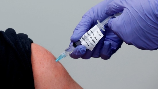 An Israeli volunteer receives the second dose of an experimental Israeli-made COVID-19 vaccine at the Sheba Medical Center, the country's largest hospital, in Ramat Gan near the coastal city of Tel Aviv, on January 14, 2021. - The Israeli vaccine is in its experimental stage and available only for volunteers of all ages, said the spokesman of the hospital. (Photo by JACK GUEZ / AFP)(AFP)