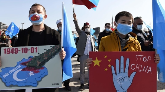 Members of the Uyghur community living in Turkey, hold banners as the join a protest against China, in Istanbul, Friday, Feb. 26, 2021. More than a million Uyghurs and other largely Muslim minorities have been swept into prisons and detention camps in China, in what China calls an anti-terrorism measure. (AP)