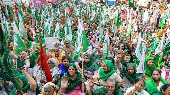 Women from Punjab and Haryana participate in farmers' protest against the Centre's new farm laws, at Tikri border in Delhi on March 8. (File photo) Women from Punjab and Haryana participate in farmers' protest against the Centre's new farm laws, at Tikri border in Delhi on March 8. (File photo)
