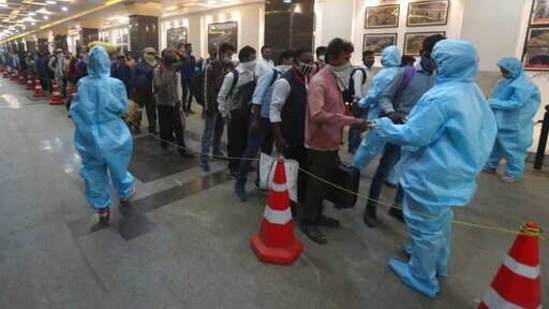Active cases stood at 36,917 in Maharashtra on February 11 while the count rose to 100,240 cases on Thursday. In picture - Passengers line up to get their temperatures checked at a train station in Mumbai. (AP)