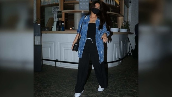 The Pagalpanti actor wore an oversized distressed denim jacket with her all-black look. (Varinder Chawla) The Pagalpanti actor wore an oversized distressed denim jacket with her all-black look. (Varinder Chawla)
