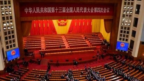 A total of 2,895 delegates voted in favour of the proposal, which will authorise its standing committee to finalise the details of the electoral reform process and applauded for the longest period after the Hong Kong electoral proposal was passed.(AP Photo)