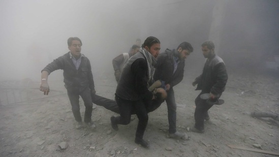 Residents carry an injured man, after what activists said were seven air-strikes by forces loyal to Syria's President Bashar al-Assad, in Duma in Eastern Al-Ghouta, near Damascus, Syria. (Reuters/ File photo)