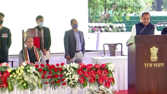Bansidhar Bhagat takes oath as a minister during the expansion of the Uttarakhand cabinet in Dehradun on Friday. (ANI Photo)