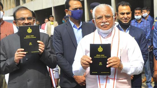 Haryana chief minister Manohar Lal Khattar arrives at the Haryana assemble with budgetary proposals for the year 2021-22, in Chandigarh on Friday. (KESHAV SINGH/HT)