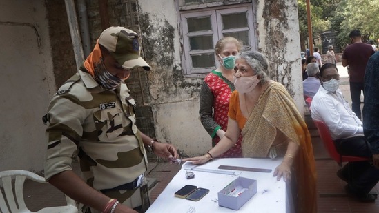An elderly Indian woman enquires about Covid-19 vaccination in Mumbai. (AP) An elderly Indian woman enquires about Covid-19 vaccination in Mumbai. (AP)