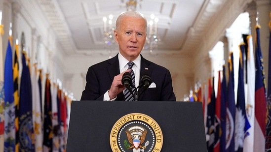 US President Joe Biden gestures as he speaks on the anniversary of the start of the Covid-19 pandemic, in the East Room of the White House in Washington, DC on March 11, 2021. (MANDEL NGAN / AFP) US President Joe Biden gestures as he speaks on the anniversary of the start of the Covid-19 pandemic, in the East Room of the White House in Washington, DC on March 11, 2021. (MANDEL NGAN / AFP)