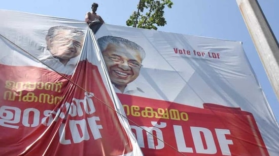 A worker puts up an election campaign banner of Kerala chief minister Pinarayi Vijayan, in Kochi A worker puts up an election campaign banner of Kerala chief minister Pinarayi Vijayan, in Kochi
