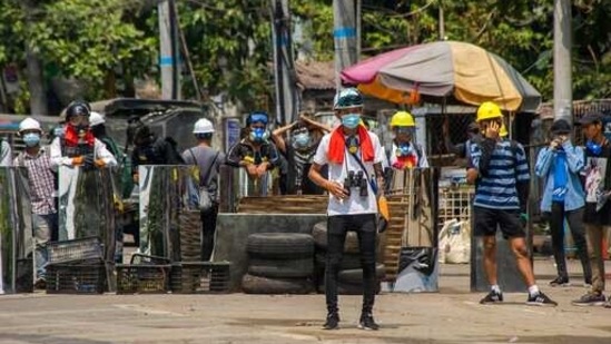 Anti-coup protesters gather with makeshift shields during a demonstration in Yangon, Myanmar, Friday, March 12, 2021. (AP) Anti-coup protesters gather with makeshift shields during a demonstration in Yangon, Myanmar, Friday, March 12, 2021. (AP)