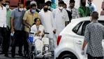 West Bengal chief minister Mamata Banerjee is wheeled out after being discharged from the SSKM Hospital in Kolkata on Friday.(ANI Photo)