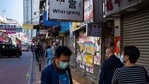 Pedestrians wearing protective masks walk past a shuttered store with lease advertisements in the Sheung Shui area of Hong Kong, China.(Bloomberg) Pedestrians wearing protective masks walk past a shuttered store with lease advertisements in the Sheung Shui area of Hong Kong, China.(Bloomberg)