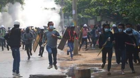 Anti-coup protesters run away after police security forces disperse them with tear gas, which the protesters countered with vapor from fire extinguishers, in Mandalay, Myanmar on March 13, 2021. (AP Photo) Anti-coup protesters run away after police security forces disperse them with tear gas, which the protesters countered with vapor from fire extinguishers, in Mandalay, Myanmar on March 13, 2021. (AP Photo)