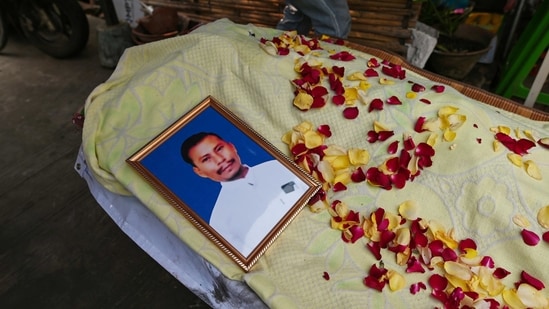 The body of Sit Thu, 37, who was killed during a raid by security forces is seen at his home in Thaketa, Yangon, Myanmar, on March 13. At least six protesters were killed by security forces in Myanmar on March 13, Reuters reported citing witnesses and media reports.(REUTERS)