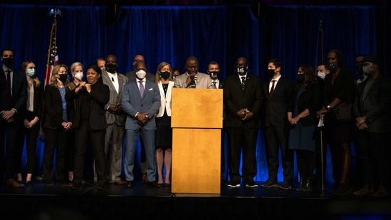 Attorney Ben Crump (C), representative of the family of George Floyd, is joined by members of the family and members of the Minneapolis city government as he speaks during a press conference at the Minneapolis Convention Centee.(AFP)