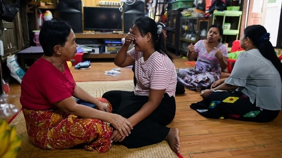 Family members of Sit Thu mourn at their home in Thaketa, Yangon, on March 13.(REUTERS)