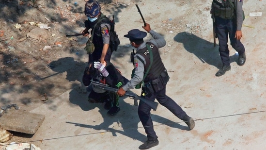 Riot police officers hold down a protester as they disperse protesters in Tharkata on the outskirts of Yangon, on March 6. US President Joe Biden’s administration described a virtual meeting with the Indian, Japanese and Australian leaders on March 12, the first official summit of the group known as the Quad, as part of a push to demonstrate a renewed US commitment to regional security.(AP/PTI)