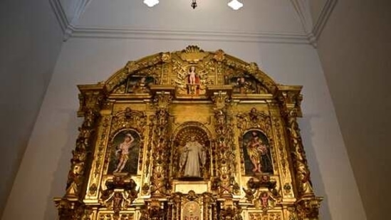 An altarpiece shows religious figures inside the second oldest Spanish church in the Americas, the San Jose Church, that will reopen following a massive reconstruction that took nearly two decades to complete in San Juan, Puerto Rico, Tuesday, March 9, 2021. All the figures depicted on the church’s gilded altar have been identified except for one: a woman with flaxen hair in the upper left-hand corner holding a palm frond, which indicates she was a martyr but offers no other clues. (AP)