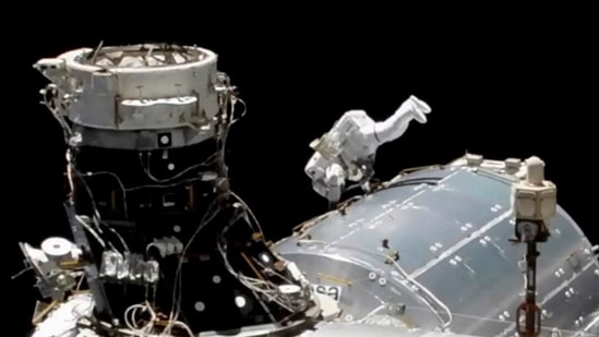 Hopkins and Victor Glover went spacewalking Wednesday to install a high-speed data link outside the International Space Station's European lab and connect cables for an experiment platform awaiting activation for almost a year.(AP)