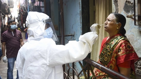 A health worker collects a swab sample of an elderly resident of Dharavi during a door-to-door screening for Covid-19, in Mumbai on Thursday. (PTI Photo ) A health worker collects a swab sample of an elderly resident of Dharavi during a door-to-door screening for Covid-19, in Mumbai on Thursday. (PTI Photo )