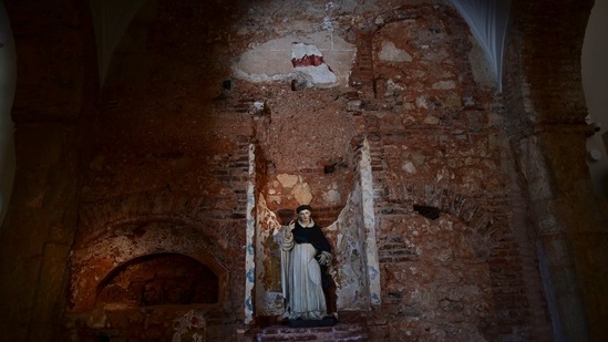A wall's original construction elements are exposed where a modern sculpture stands inside the second oldest Spanish church in the Americas, the San Jose Church, that will reopen following reconstruction that took nearly two decades to complete, in San Juan, Puerto Rico, Tuesday, March 9, 2021. The church’s history was intentionally left exposed in some areas as part of the restoration. (AP)
