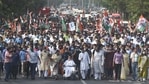 West Bengal Chief minister and All India Trinamool Congress (TMC) supremo Mamata Banerjee is seen on a wheelchair as she and a large number of TMC supporters participate in a rally on Nandigram Divas ahead of the Assembly election, at Mayo Road, in Kolkata, on March 14.(Samir Jana / HT Photo)