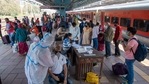 A health care worker collects swab sample from travellers for coronavirus screening at Dadar station in Mumbai, (Pratik Chorge/Hindustan Times) A health care worker collects swab sample from travellers for coronavirus screening at Dadar station in Mumbai, (Pratik Chorge/Hindustan Times)