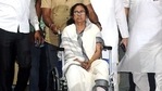West Bengal Chief Minister Mamata Banerjee comes out on a wheelchair after being discharged from the SSKM Hospital in Kolkata on March 12, 2021. (ANI Photo)