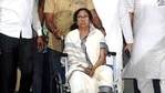West Bengal Chief Minister Mamata Banerjee comes out on a wheelchair after being discharged from the SSKM Hospital in Kolkata on Friday. (ANI Photo)